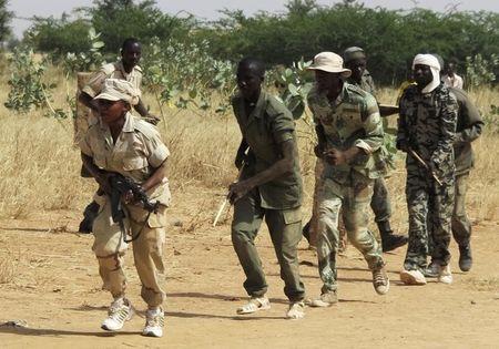 Members of a Malian pro-government militia operating in government-controlled areas take part in a training session at their base in Sevare, about 600 km (400 miles) northeast of the capital Bamako, November 12, 2012. PHOTO BY REUTERS/Adama Diarra