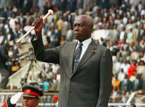 President Daniel Arap Moi raises his baton to salute Kenyans during the 34th independence day celebrations in Nairobi, Kenya, December 12, 1997. PHOTO BY REUTERS/George Mulala