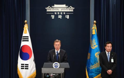 South Korea's new President Moon Jae-In speaks as Prime Minister nominee Lee Nak-Yon (R) listens to during a press conference at the presidential Blue House in Seoul on May 10, 2017. PHOTO BY REUTERS/Jung Yeon-Je