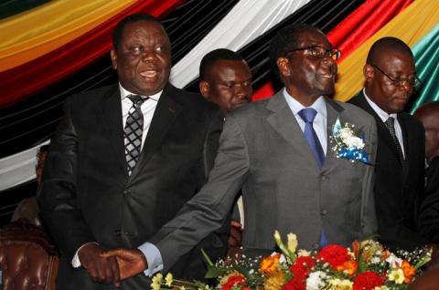 Zimbabwe's President Robert Mugabe (front R) and Prime Minister Morgan Tsvangirai (L) attend a conference of parties and civic society groups reviewing a draft constitution that, if adopted, will lead to Zimbabwe's next election, at a hotel in Harare, October 22, 2012. PHOTO BY REUTERS/Philimon Bulawayo
