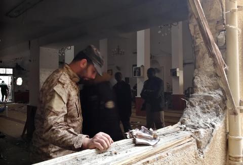 A member of the Libyan National Army inspects the damage following a twin bombing inside a mosque in Benghazi, Libya, February 9, 2018. PHOTO BY REUTERS/Stringer