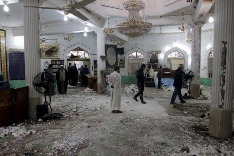 People gather at a Shi'ite mosque after a suicide bomb attack, in Baghdad, February 26, 2016. PHOTO BY REUTERS/Khalid al Mousily