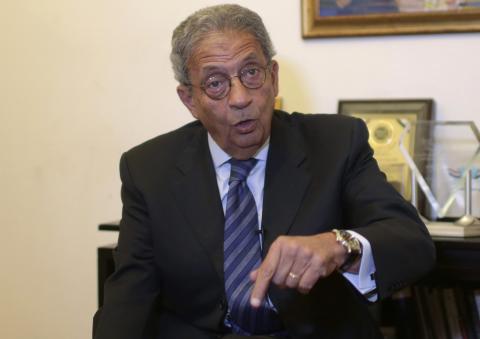Former foreign minister and presidential candidate Amr Moussa speaks during an interview with Reuters in Cairo