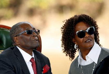 Zimbabwe's former president Robert Mugabe and his wife Grace look on after addressing a news conference at his private residence nicknamed "Blue Roof" in Harare, Zimbabwe, July 29, 2018. PHOTO BY REUTERS/Siphiwe Sibeko