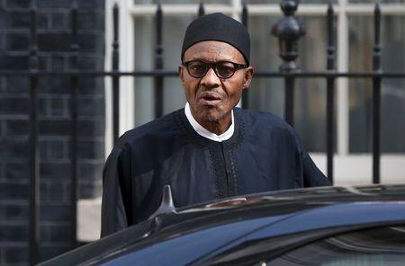 Nigeria's President-elect Muhammadu Buhari departs after meeting with Britain's Prime Minister David Cameron at Downing Street in London, England, May 23, 2015. PHOTO BY REUTERS/Neil Hall