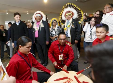 (L to R) Prime Minister Justin Trudeau with Edmund Bellagarde, Vice Tribal Chairperson Elaine Chicoose and and FSIN Chief Bobby Cameron listen to the Paskwa Drummers before meeting the File Hills Qu'Appelle Tribal Council in Fort Qu'Appelle, Saskatchewan, Canada, April 26, 2016. PHOTO BY REUTERS/David Stobbe