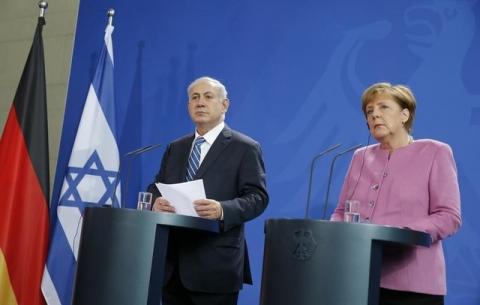 Israeli Prime Minister Benjamin Netanyahu (L) and German Chancellor Angela Merkel address a news conference at the Chancellery in Berlin, Germany, February 16, 2016. PHOTO BY REUTERS/Fabrizio Bensch