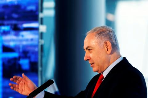 Israeli Prime Minister Benjamin Netanyahu speaks during the dedication ceremony of a new concourse at the Ben Gurion International Airport, near Lod, Israel, February 15, 2018. PHOTO BY REUTERS/Ronen Zvulun