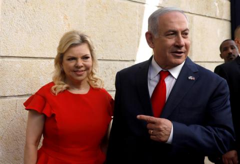 Israeli Prime Minister Benjamin Netanyahu and his wife Sara Netanyahu stand next to the dedication plaque of the U.S. embassy in Jerusalem, after the dedication ceremony of the new U.S. embassy in Jerusalem, May 14, 2018. PHOTO BY REUTERS/Ronen Zvulun