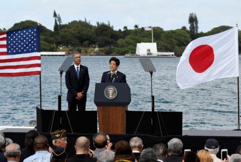 Japanese Prime Minister Shinzo Abe give remarks as U.S. President Barack Obama listens at Kilo Pier overlooking the USS Arizona Memorial at Joint Base Pearl Harbor-Hickam in Honolulu, Hawaii, U.S., December 27, 2016. PHOTO BY REUTERS/Hugh Gentry