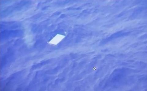 A view of an object floating in the water is seen on a computer screen onboard a Royal New Zealand Air Force (RNAF) plane searching for wreckage from Malaysia Airlines Flight MH370 in the new Indian Ocean search area in this March 28, 2014 still image taken from video. REUTERS
