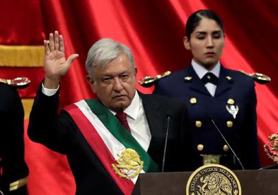 Mexico's new President Andres Manuel Lopez Obrador, wearing the presidential sash, gestures during his inauguration ceremony at Congress, in Mexico City, Mexico, December 1, 2018. PHOTO BY REUTERS/Henry Romero