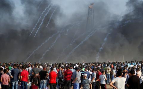 Tear gas canisters are fired by Israeli troops at Palestinians during a protest calling for lifting the Israeli blockade on Gaza and demanding the right to return to their homeland, at the Israel-Gaza border fence east of Gaza City, September 28, 2018. PHOTO BY REUTERS/Mohammed Salem