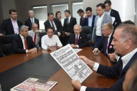 Gursel Tekin, a lawmaker from the main opposition Republican People's Party (CHP) holds a print copy of Sozcu daily newspaper as they visit the publication's headquarters in Istanbul, Turkey, May 19, 2017. PHOTO BY REUTERS/Ziya Koseoglu