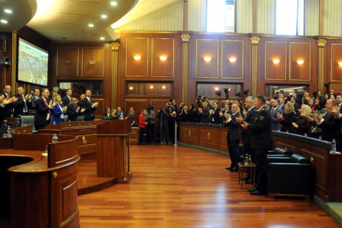 Kosovo's President Hashim Thaci (C), Prime Minister Ramush Haradinaj (L) and Kosovo Security Forces Commander Lt. Gen. Rrahman Rama applaud after parliament approved formation of national Kosovo army in Pristina, Kosovo, December 14, 2018. PHOTO BY REUTERS/Laura Hasani