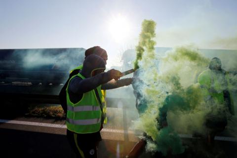 People wearing yellow vests, a symbol of French drivers' nationwide protest against higher fuel prices, block the Paris-Brussels motorway in Haulchin, France, November 17, 2018. PHOTO BY REUTERS/Pascal Rossignol