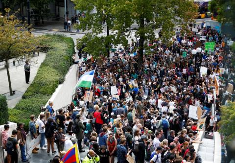 People gather at Seattle City Hall during a Climate Strike march in Seattle, Washington, U.S., September 20, 2019. PHOTO BY REUTERS/Lindsey Wasson