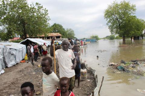 People stand next to makeshift structures after heavy rains and floods forced hundreds of thousands of people to leave their homes, in the town of Pibor, South Sudan, November 6, 2019. PHOTO BY REUTERS/Stephen Tekajuok