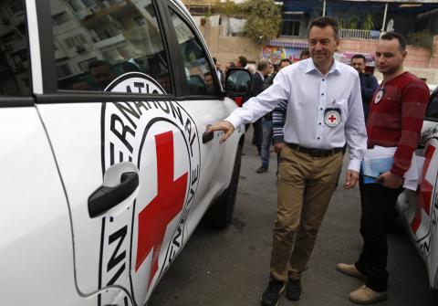Peter Maurer, president of the International Committee of the Red Cross (ICRC), enters his vehicle after visiting a shelter hosting displaced families in the Damascus suburb of Barzeh, November 14, 2014. PHOTO BY REUTERS/Omar Sanadiki