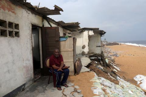 Pastor Peter Bassey, a resident of 20 years, talks about how the storms lashing the coast are gradually destroyed his building in Port Bouet, an area of Abidjan, Ivory Coast, July 17, 2019. PHOTO BY REUTERS/Luc Gnago