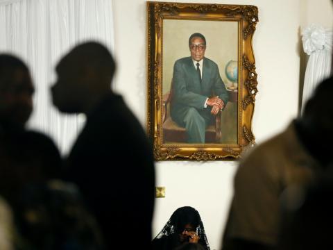 Grace Mugabe sits below a portrait of her late husband, former Zimbabwean President Robert Mugabe, at her residence, The 'Blue Roof' in Borrowdale, Harare, Zimbabwe, September 11,2019. PHOTO BY REUTERS/Philimon Bulawayo