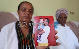 Yerusalem Kawiso, 48, a government employee who lost a brother, a brother in law and a great uncle to Sidama struggle, holds a picture of her two years-old niece, Amen Teferi, and her deceased brother, after voting for the Sidama autonomy during the referendum vote in Hawassa, Ethiopia, November 20, 2019. PHOTO BY REUTERS/Tiksa Negeri