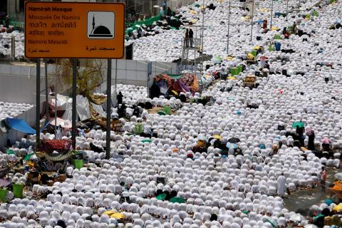 Muslim pilgrims pray outside Namira Mosque on the plains of Arafat during the annual haj pilgrimage, outside the holy city of Mecca, Saudi Arabia, August 20,2018. PHOTO BY REUTERS/Zohra Bensemra