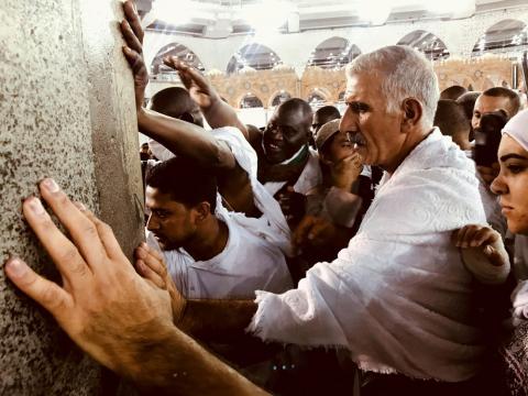 Muslim pilgrims touch the wall of the Kaaba during Tawaf al-Ifada after Arafat day during the annual haj pilgrimage at the Grand Mosque in the holy city of Mecca, Saudi Arabia, August 21, 2018. PHOTO BY REUTERS/Zohra Bensemra