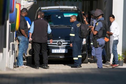 Police raid the home of the Gupta family, friends of President Jacob Zuma, in Johannesburg, South Africa, February 14, 2018. PHOTO BY REUTERS/James Oatway