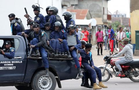 Police sit in a pickup vehicle in front of Notre Dame Cathedral in Kinshasa, Democratic Republic of Congo, February 25, 2018. PHOTO BY REUTERS/Goran Tomasevic