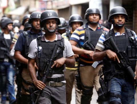 Security personnel leave the site after a police operation on militants on the outskirts of Dhaka, Bangladesh, July 26, 2016. PHOTO BY REUTERS/Mohammad Ponir Hossain