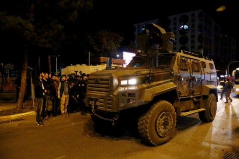 An armored police vehicle is parked in front of the Metropolitan Municipality headquarters in the Kurdish-dominated southeastern city of Diyarbakir, Turkey, October 25, 2016. PHOTO BY REUTERS/Sertac Kayar