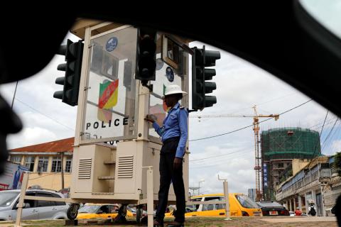 A traffic policewoman stands beside a traffic light in downtown Yaounde, Cameroon, October 9, 2018. PHOTO BY REUTERS/Zohra Bensemra