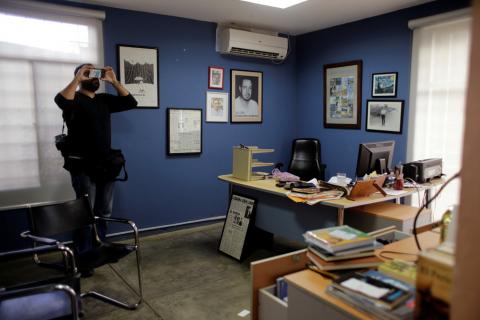 A local photographer makes a video of journalist Carlos Fernando Chamorro's office, which was raided Thursday night by the national police in Managua, Nicaragua, December 14, 2018. PHOTO BY REUTERS/Oswaldo Rivas