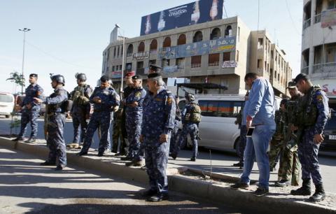 Iraqi security forces gather at the site of a bomb attack in Baghdad's Bab Sharji district, March 29, 2016. PHOTO BY REUTERS/Khalid al Mousily