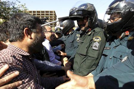Policemen clash with demonstrators during a protest against Saudi Arabia after a crush in which at least 155 Iranians were killed at the haj pilgrimage, in front of Saudi Arabia's embassy in Tehran, September 27, 2015. PHOTO BY REUTERS/Raheb Homavandi