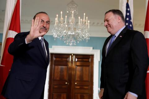 Turkey's Foreign Minister Mevlut Cavusoglu (L) waves to the media before a meeting with U.S. Secretary of State Mike Pompeo (R) at the State Department in Washington, U.S., November 20, 2018. PHOTO BY REUTERS/Yuri Gripas