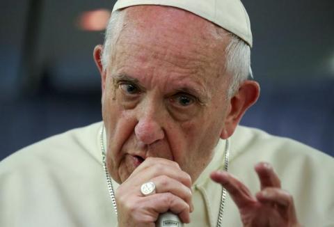 Pope Francis gestures during a news conference on board of the plane during his flight back from a trip to Chile and Peru, January 22, 2018. PHOTO BY REUTERS/Alessandro Bianchi