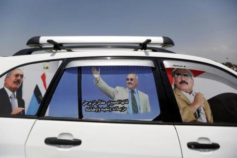 Posters of of Yemen's former President Ali Abdullah Saleh are seen on a car at a square where Saleh's party, the General People's Congress, is preparing to hold a rally to mark the 35th anniversary of its establishment in Sanaa, Yemen, August 22, 2017. PHOTO BY REUTERS/Khaled Abdullah