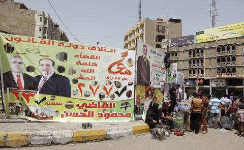 An election poster of Mahmoud Al-Hassan of Prime Minister Nuri al-Maliki's State of Law coalition is displayed along a street at the start of the election campaign in Baghdad
