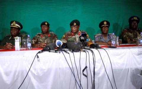 Commander of Zimbabwe Defence Forces General Costantino Chiwenga (C) addresses the media with other security chiefs in Harare, Zimbabwe, November 20, 2017. PHOTO BY REUTERS/Philimon Bulawayo