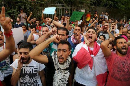 Protesters gesture and chant slogans ahead of a march towards the government building in Beirut, Lebanon, August 24, 2015. PHOTO BY REUTERS/Aziz Taher