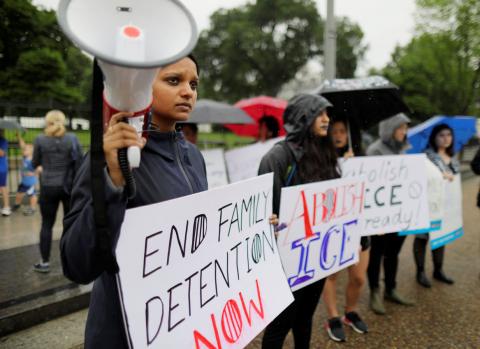 Demonstrator Sara Mathews plays a recording of the cries of illegal immigrant children held in a U.S. detention facility after being separated from their parents during a protest against the separation of immigrant families outside the White House in Washington, U.S., June 22, 2018. PHOTOT BY REUTERS/Jim Bourg