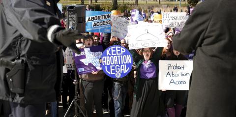 Police keep watch as protesters demonstrate in front of the U.S. Supreme Court on the morning that the court took up a major abortion case focusing on whether a Texas law that imposes strict regulations on abortion doctors and clinic buildings interferes with the constitutional right of a woman to end her pregnancy in Washington, March 2, 2016. PHOTO BY REUTERS/Kevin Lamarque