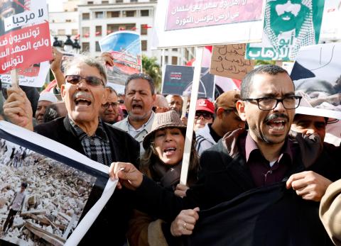 People chant slogans and hold banners as they take part in a protest, opposing the visit of Saudi Arabia's Crown Prince Mohammed bin Salman in Tunis, Tunisia, November 27, 2018. PHOTO BY REUTERS/Zoubeir Souissi