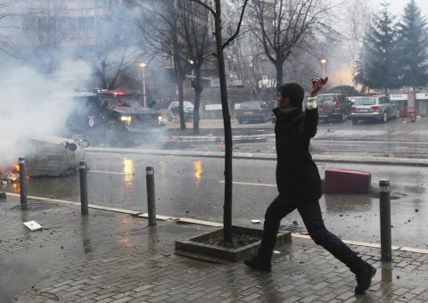 An anti-government protester throws a stone to the police during a demonstration in central Pristina, January 27, 2015. PHOTO BY REUTERS/Hazir Reka
