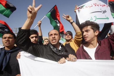 Protesters march during a demonstration, calling on militiamen to leave, in Tripoli