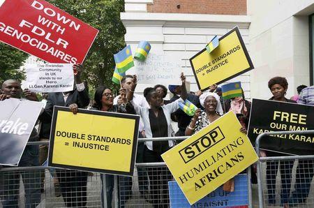 Protesters demanding the release of Rwanda's intelligence chief Karenzi Karake celebrate outside Westminster Magistrates Court after he was bailed for a bond of GB Pounds 1 Million in London, Britain, June 25, 2015. PHOTO BY REUTERS/Stefan Wermuth