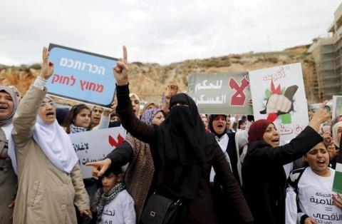 Israeli Arab women protesters shout slogans during a demonstration against the outlawing of the Islamic Movement's northern branch, in the northern Israeli-Arab town of Umm el-Fahm, November 28, 2015. PHOTO BY REUTERS/Ammar Awad