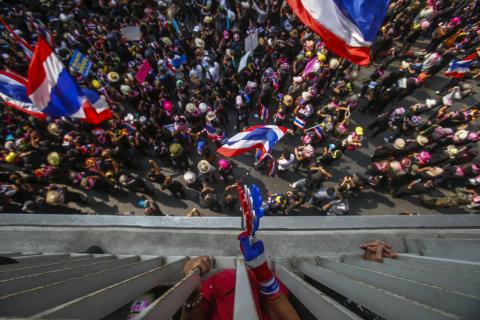 Anti-government protesters gather outside the Royal Thai Police headquarters during a rally in central Bangkok